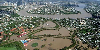 What are the long-term implications for Brisbane and other flooded areas after 2022 disaster?
